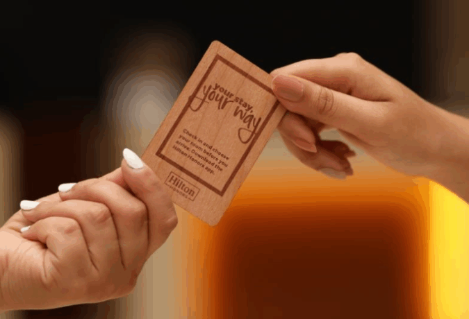RFID Hotel and Hilton Worldwide partnership logo, highlighting RFID Hotel as an approved global vendor for Hilton Supply Management providing RFID key cards, key wallets, door signs, and wristbands.