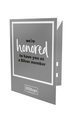 Hilton Honors Silver key packet in an elegant silver-grey colour with white border and “we’re honored to have you as a Silver member” text.