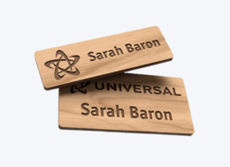 Sustainable wooden name badges engraved with company logo and staff name, ideal for hotels, restaurants, and hospitality teams