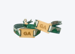 Eco-friendly fabric wristbands with bamboo clasp and green forest design, featuring engraved GA letters.